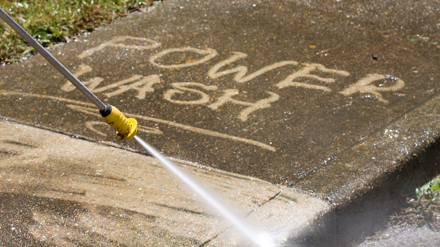 A fire hydrant spewing water onto a sidewalk